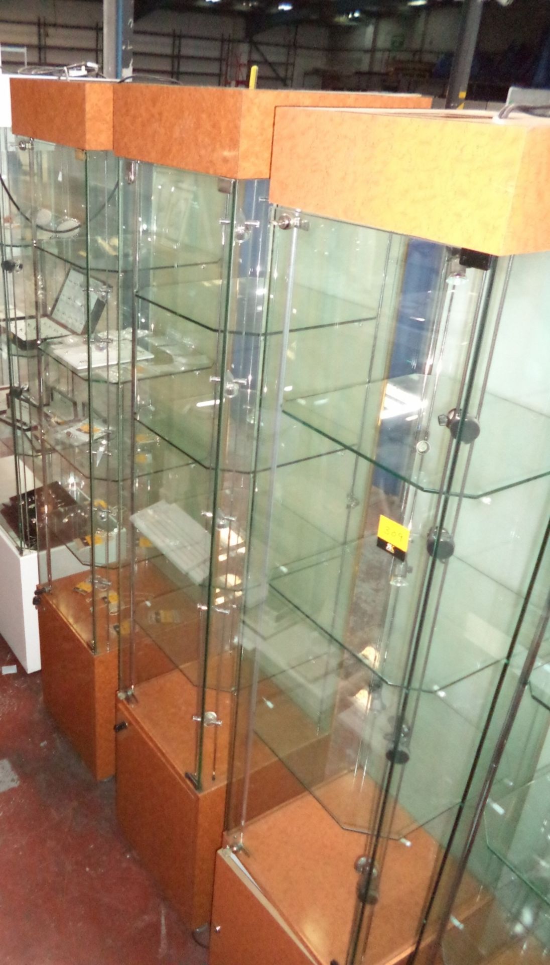 3 off illuminated glass display cupboards, each circa 198cms high, with footprint of 41cms square,