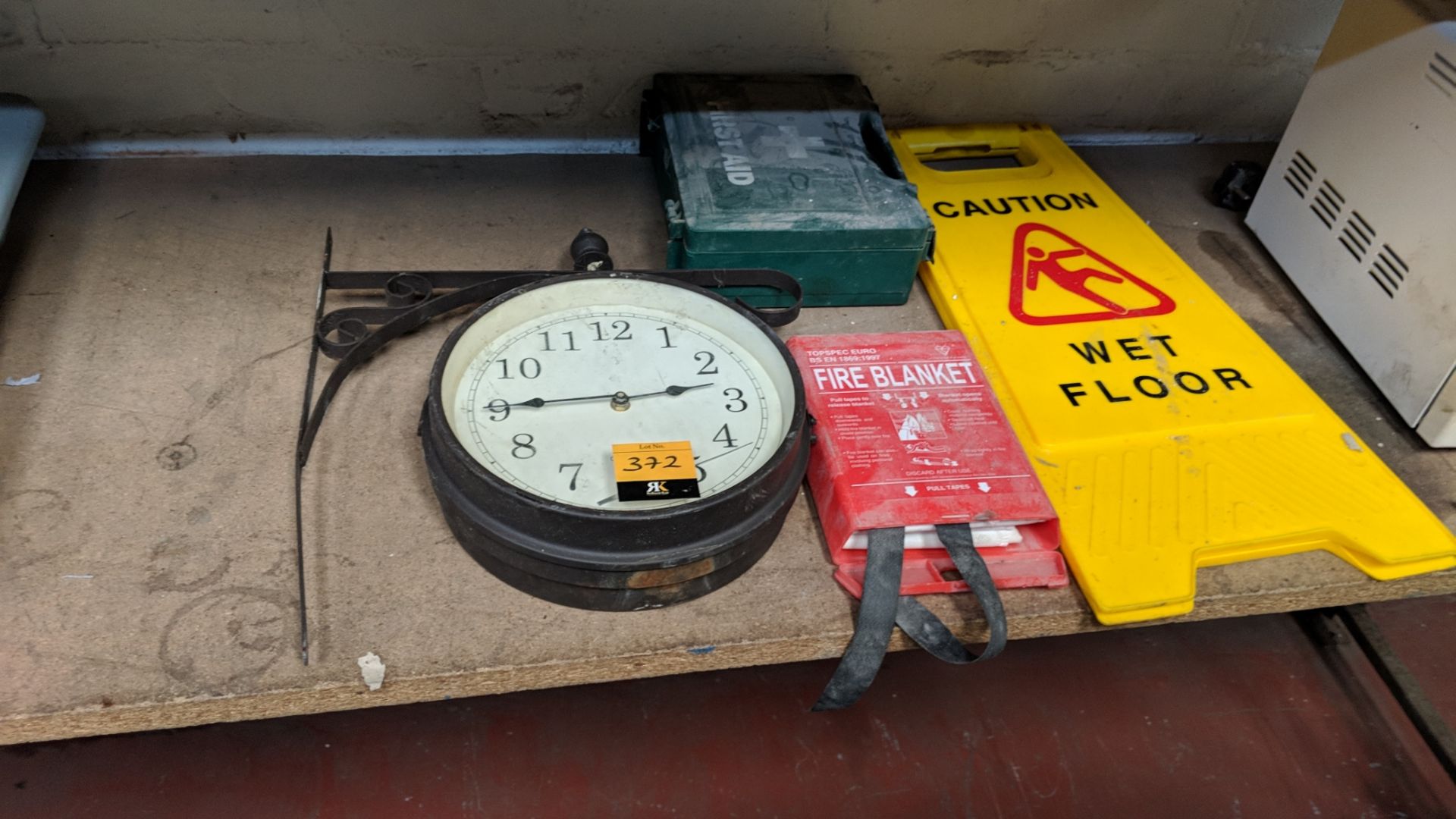 Mixed lot comprising traditional style clock plus first aid kit, fire blanket, "Wet Floor" sign - Image 2 of 4