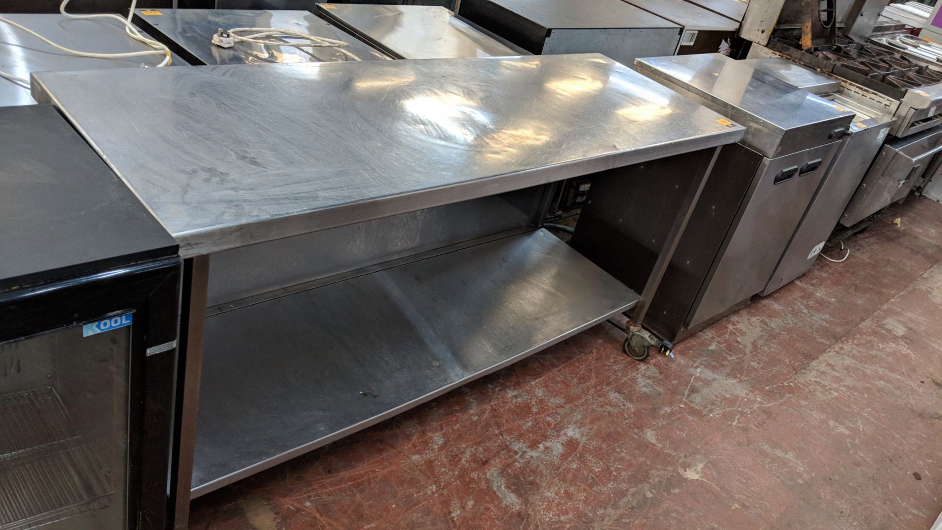 Large stainless steel mobile twin-tier table measuring circa 1800mm x 600mm x 900mm IMPORTANT: