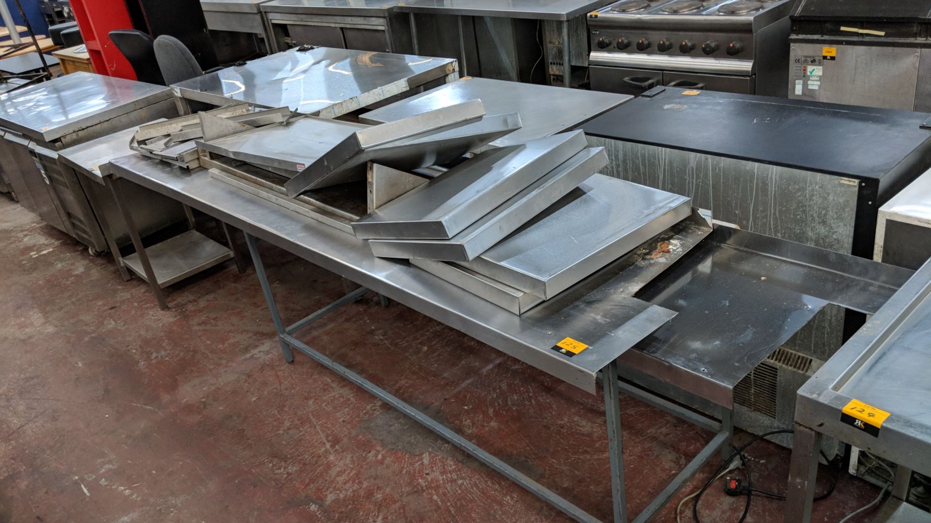 Quantity of stainless steel shelves, bases, tops and similar NB. Table upon which they are displayed