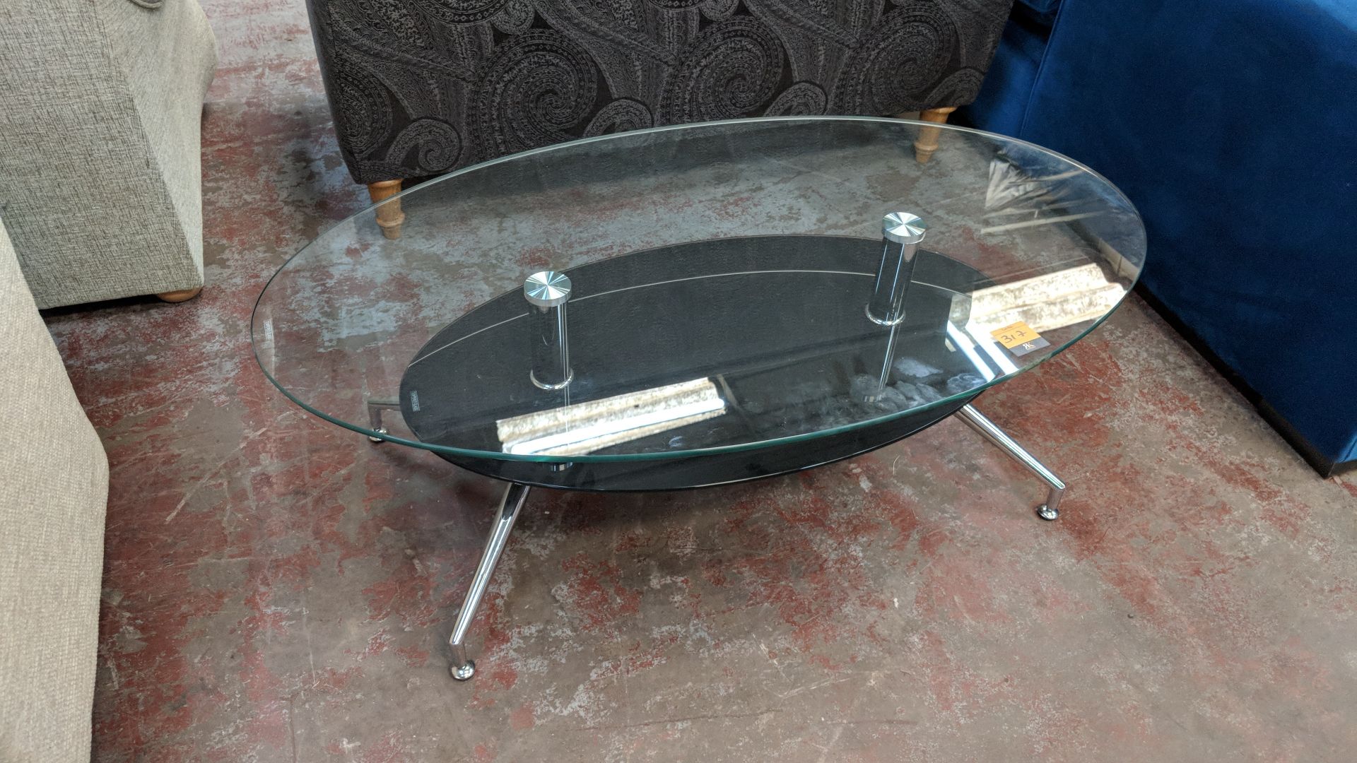 Oval glass twin tier table, top shelf measuring approximately 1200mm x 700mm IMPORTANT: Please - Image 2 of 3