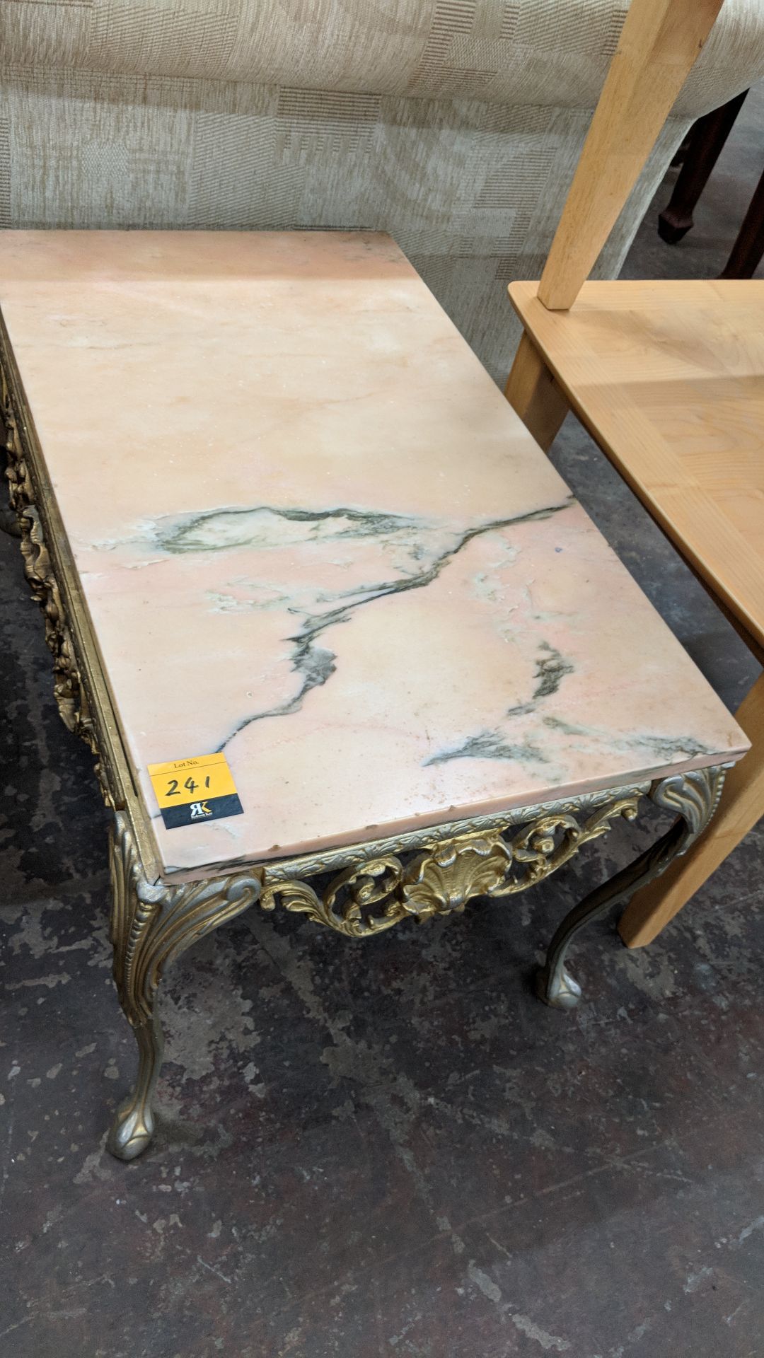 Traditional table in what appears to be brass with marble or marble type top, measuring