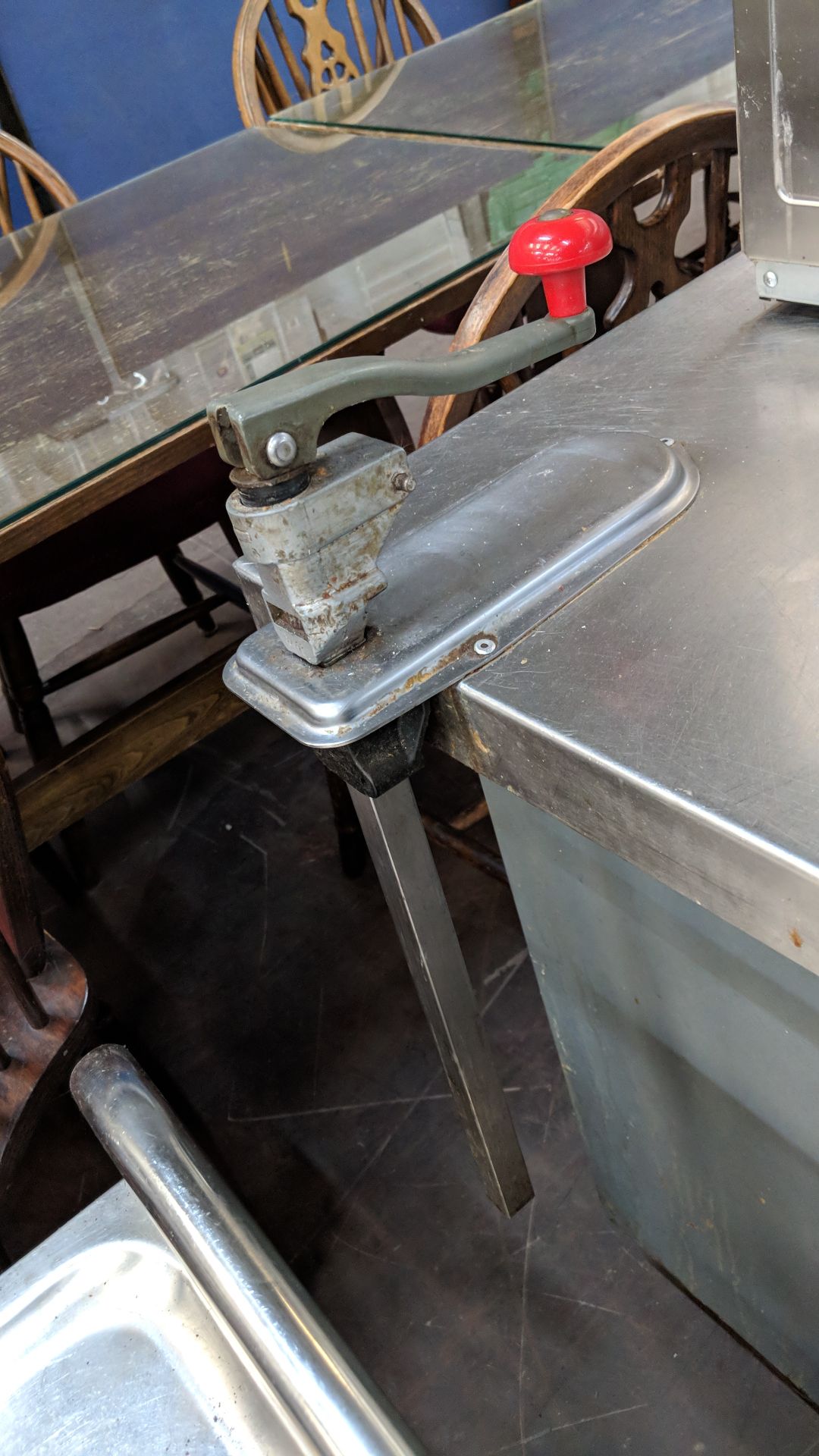 Long stainless steel twin-tier table with commercial can opener attached to same, table being - Image 4 of 4