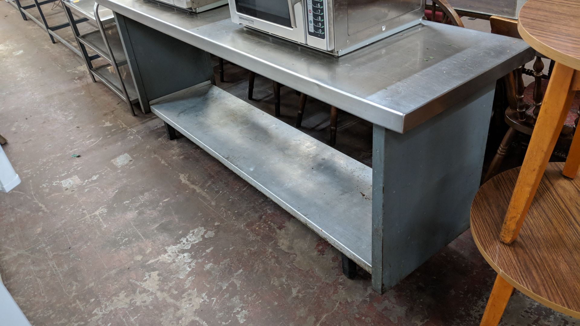 Long stainless steel twin-tier table with commercial can opener attached to same, table being - Image 2 of 4