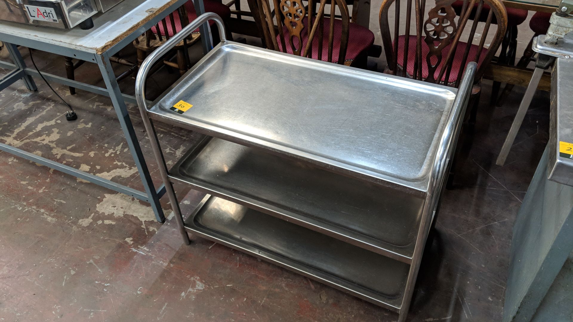 Stainless steel triple-tier trolley NB. No wheelsLots 20 - 77 and lots 302 - 318 comprise of the