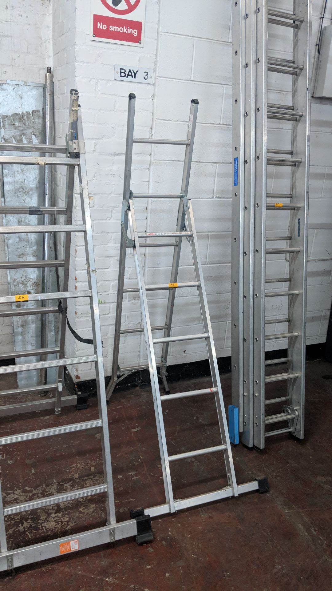 Werner Abru combination ladder system including stabilizer bar at one end