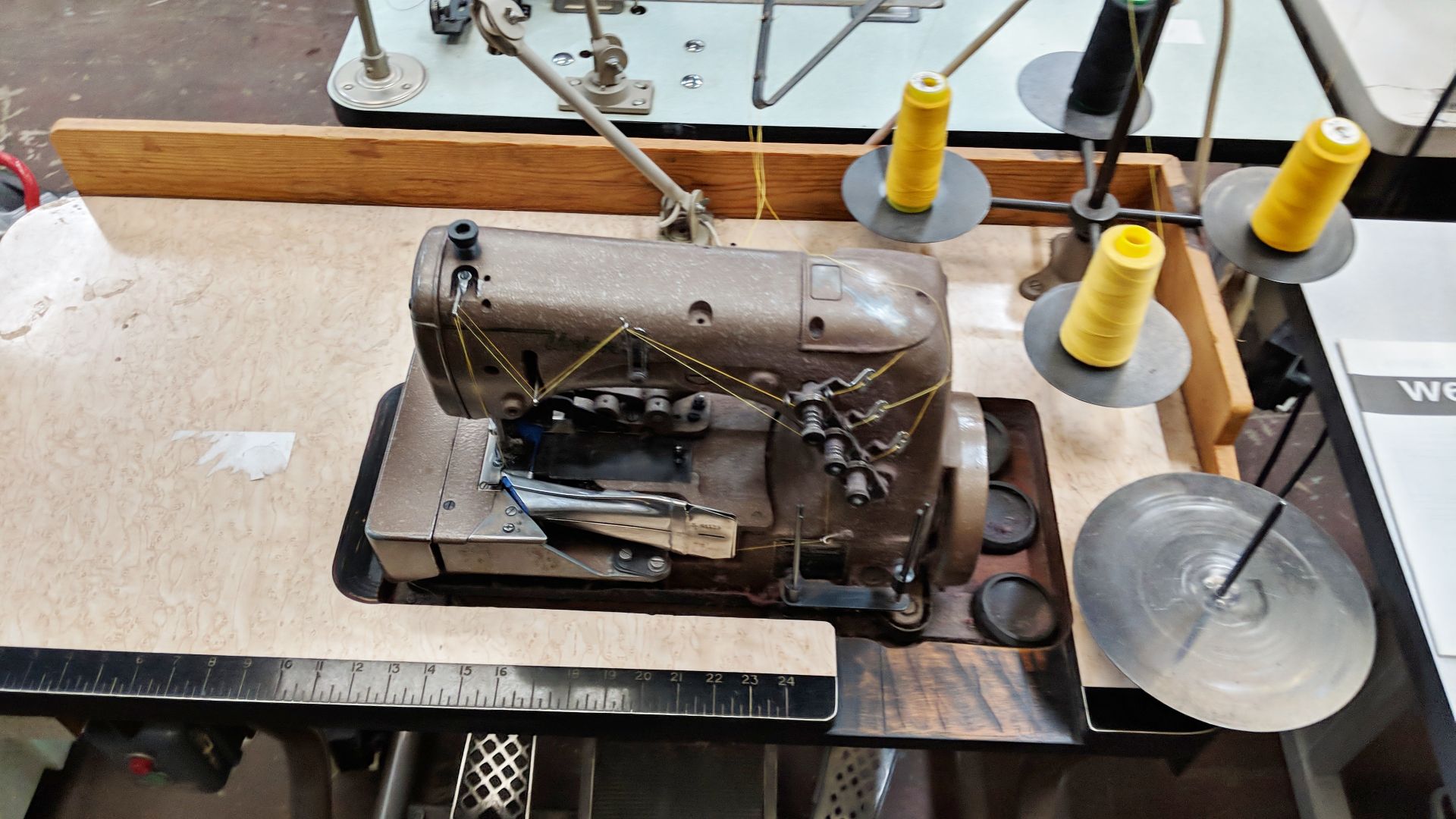 Union Special overlocker sewing machine on bench with tape feed attachments, including foot & hand - Image 5 of 8