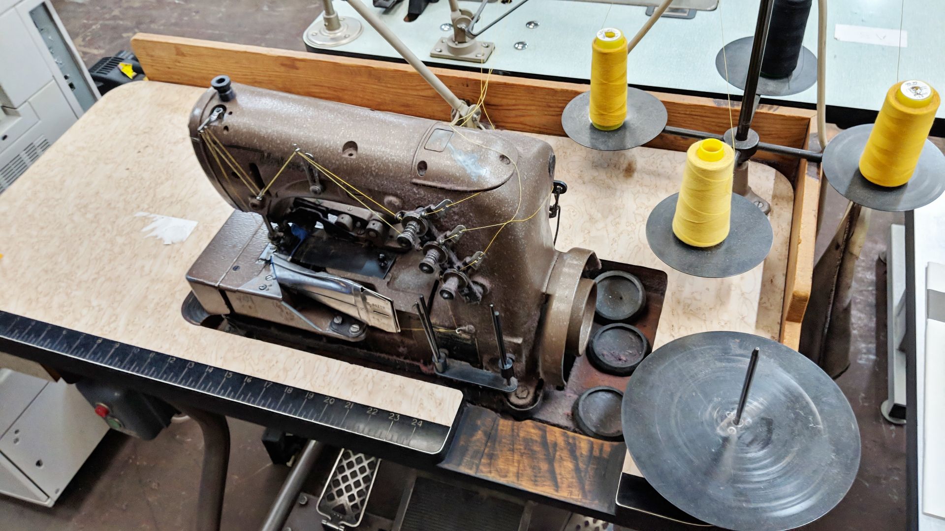 Union Special overlocker sewing machine on bench with tape feed attachments, including foot & hand - Image 7 of 8