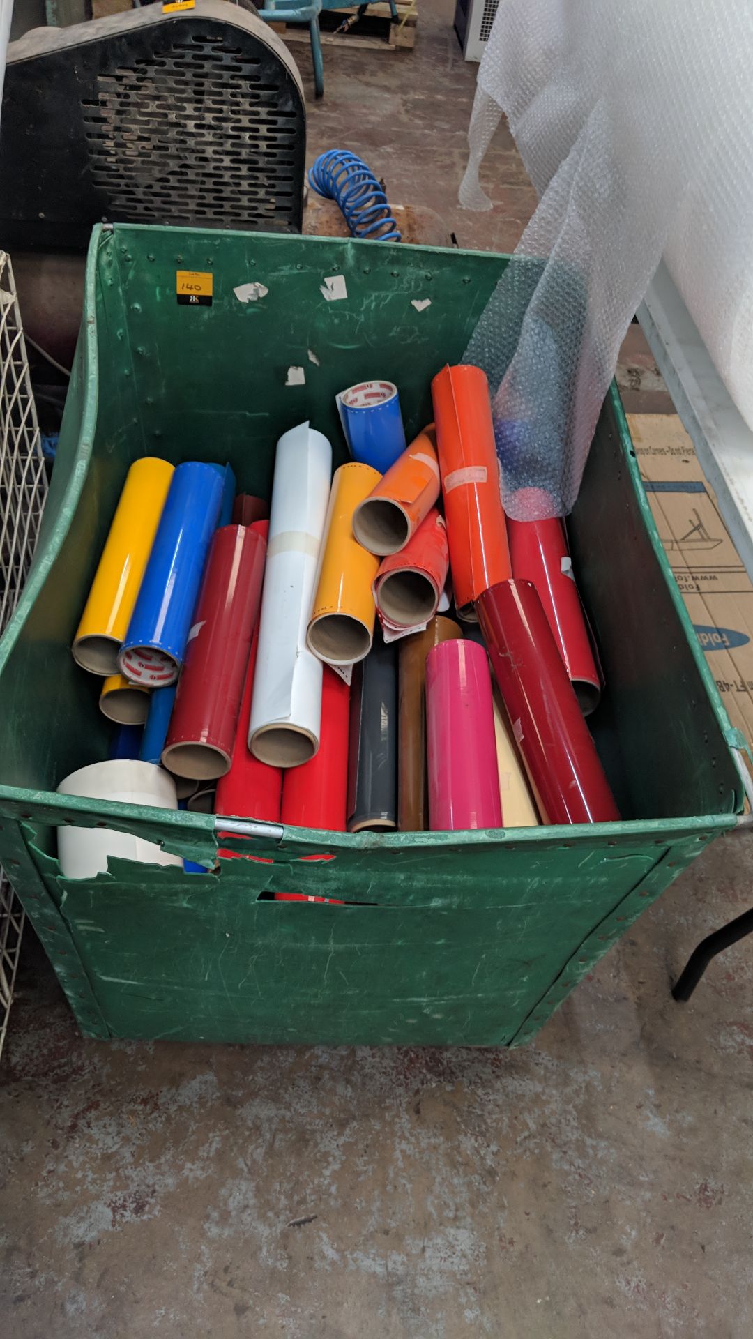 Contents of a wheelie bin of assorted vinyl off-cut rolls