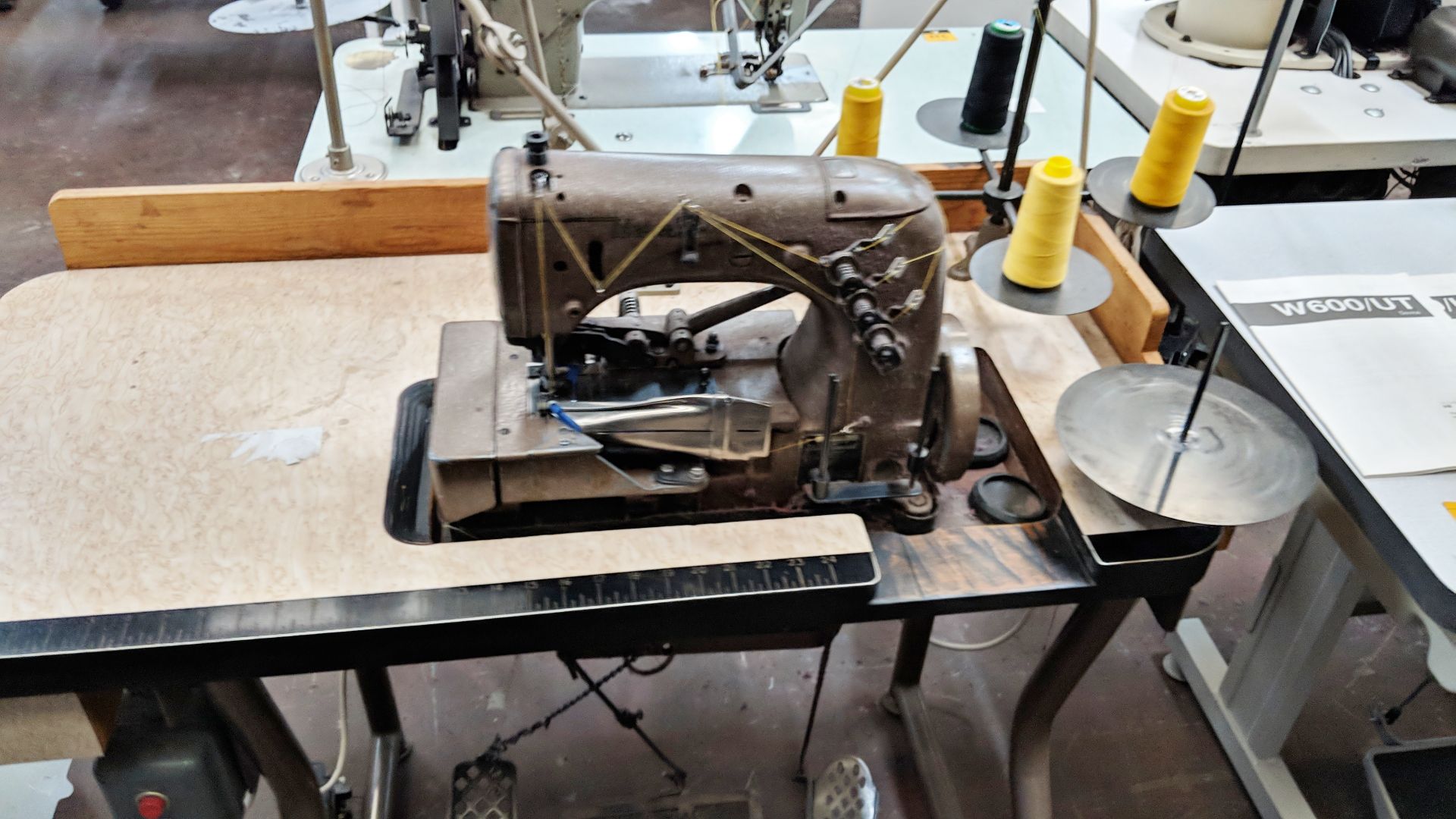 Union Special overlocker sewing machine on bench with tape feed attachments, including foot & hand - Image 4 of 8