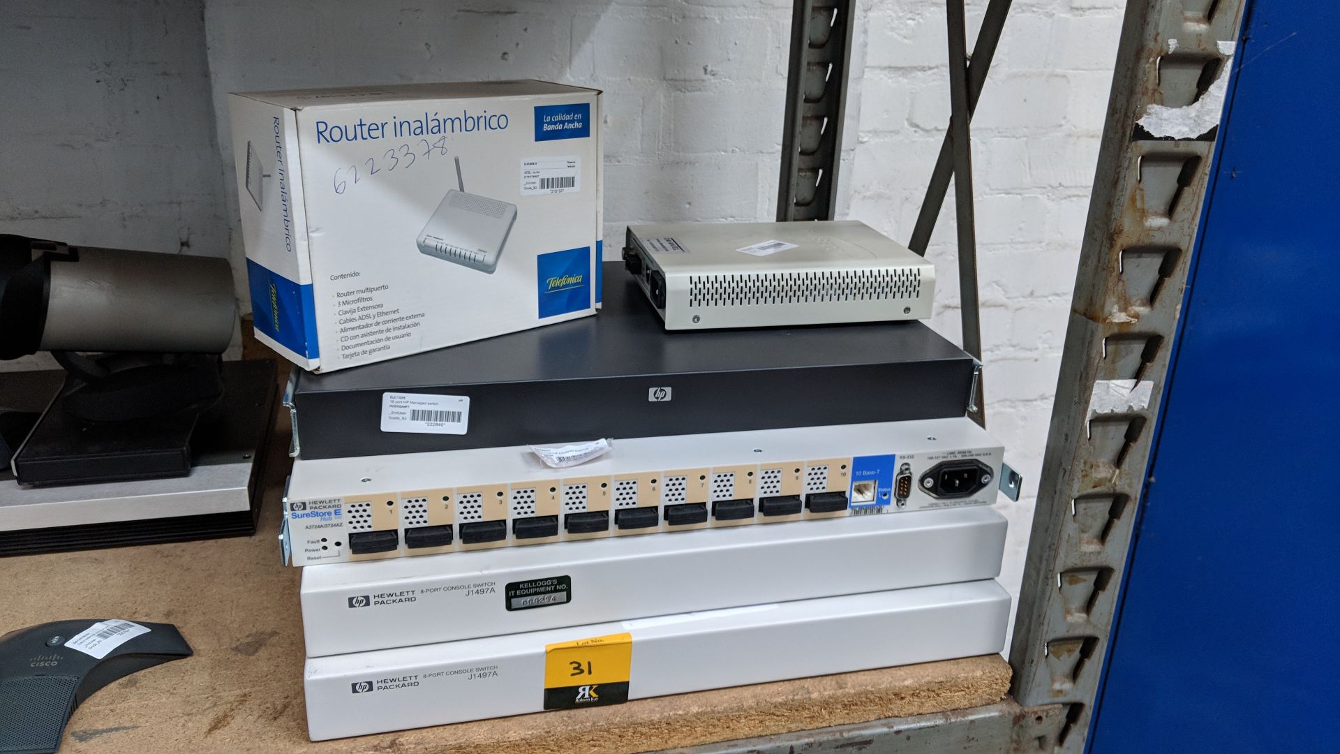 Switches & networking items comprising small router, Raisecom mini fibre switch, HP 16-port