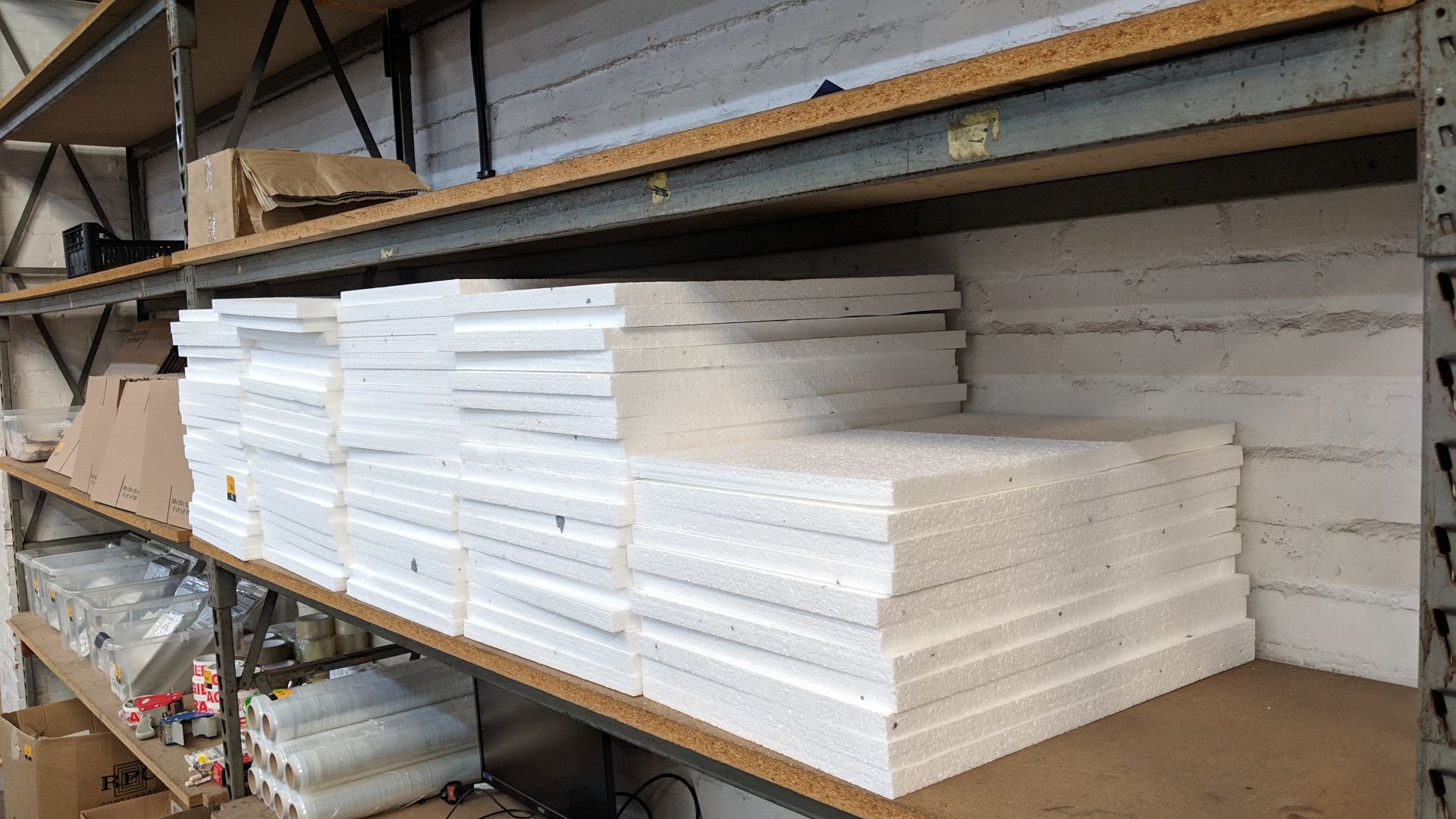 The contents of a bay of polystyrene sheets, in 5 stacks, each sheet measuring approximately 600mm x