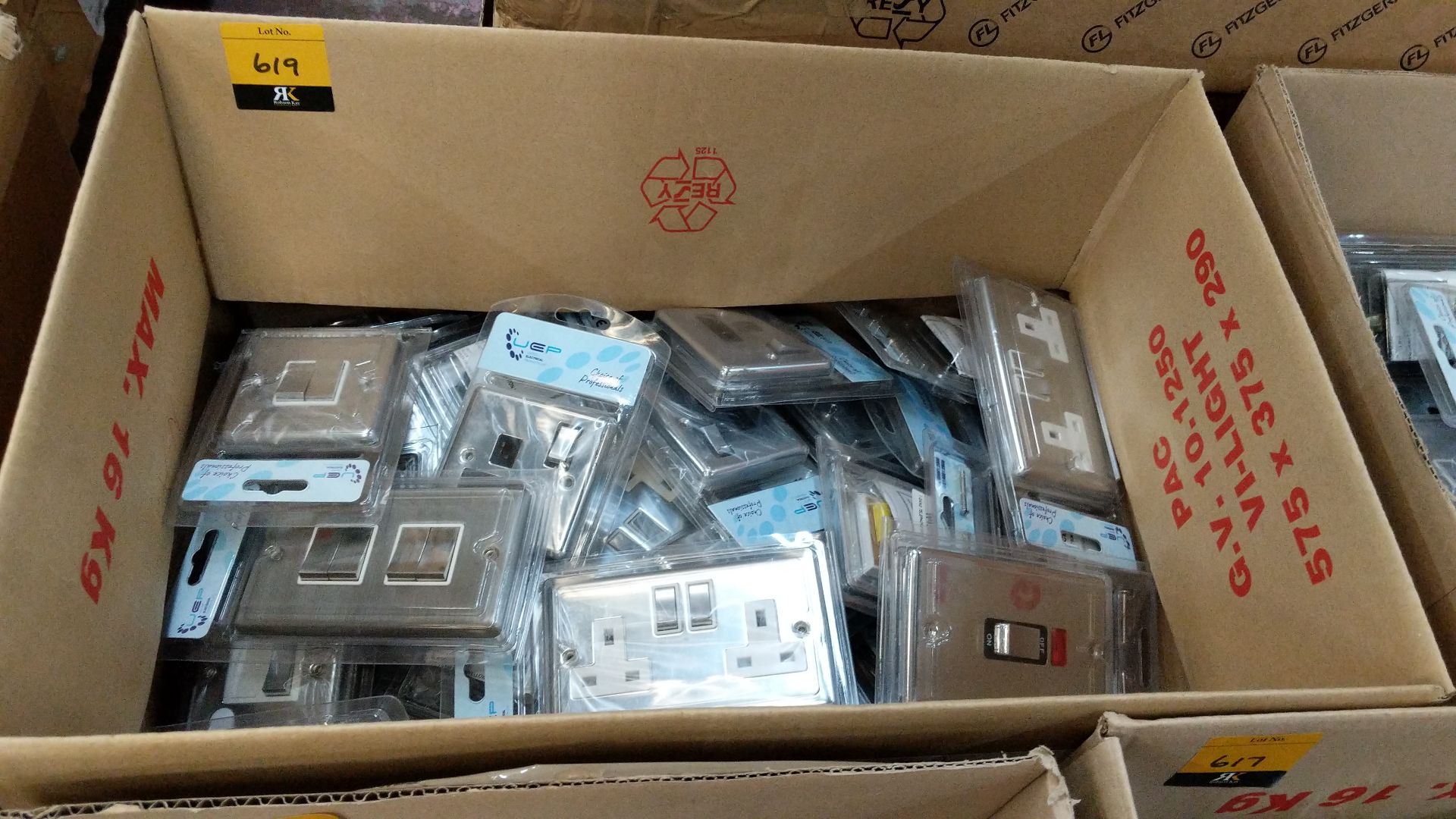 The contents of a box of assorted UEP chrome finish plug sockets, switches, fused switches & similar