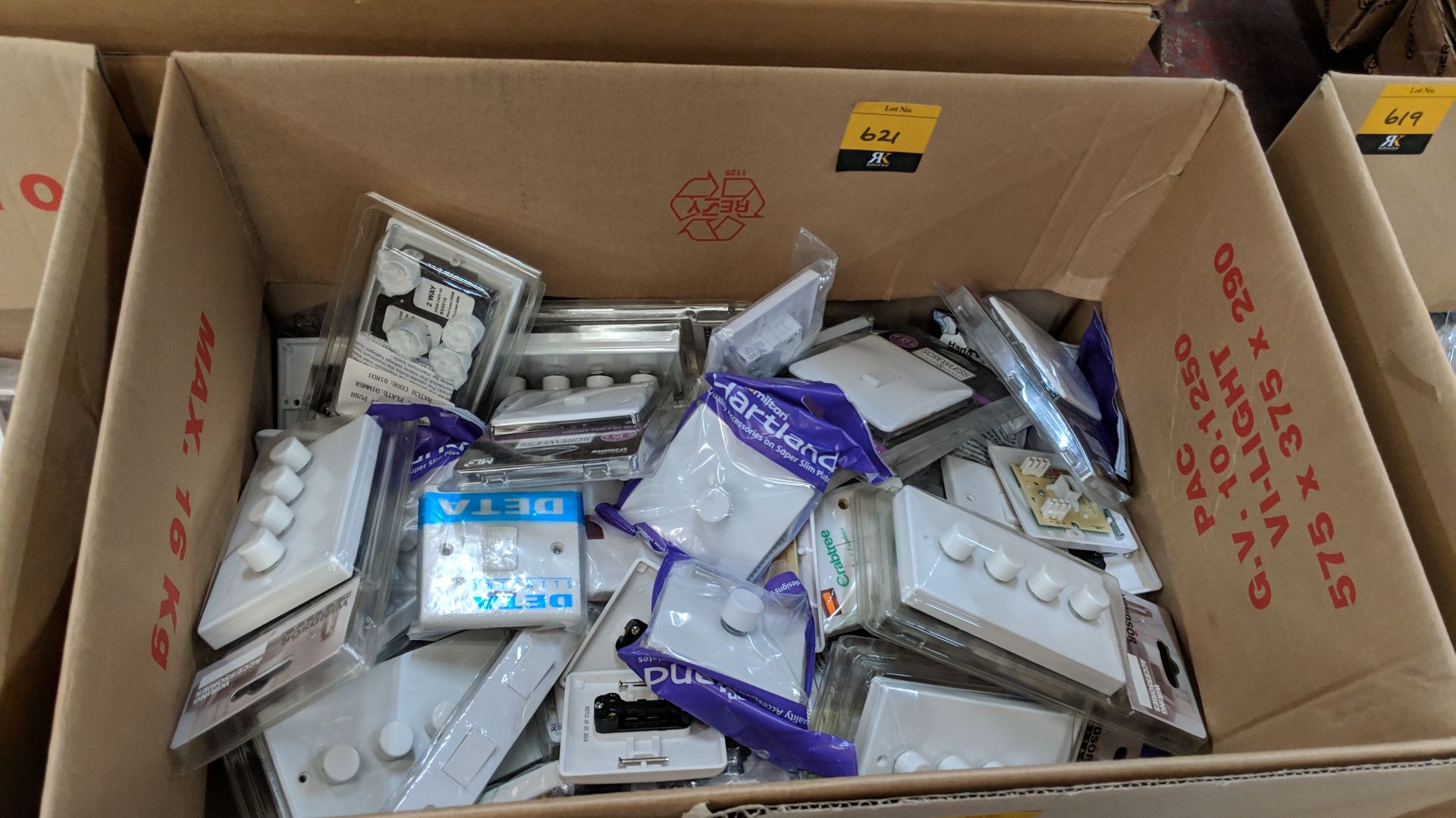 Box of assorted moulded white plastic dimmer & regular light switches & related items This lot is
