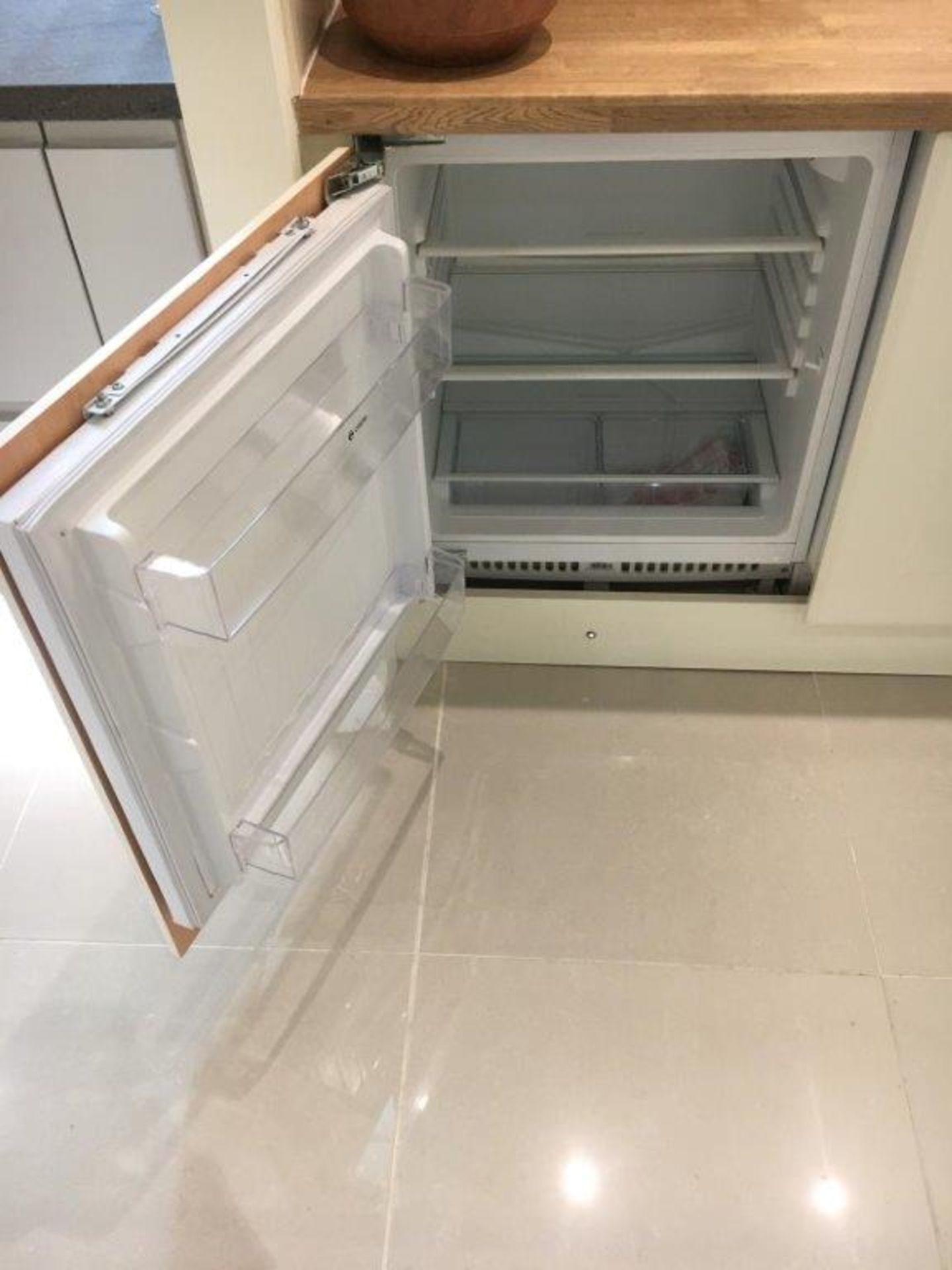 Caple built-under integrated fridge model RBL3. IMPORTANT: Please remember goods successfully bid