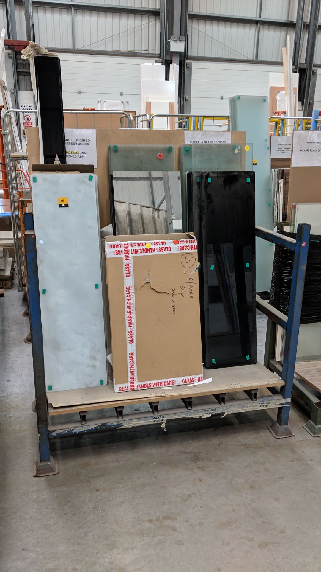 Contents of a stillage of assorted clear & frosted glass plus panels of mirror NB. Stillage