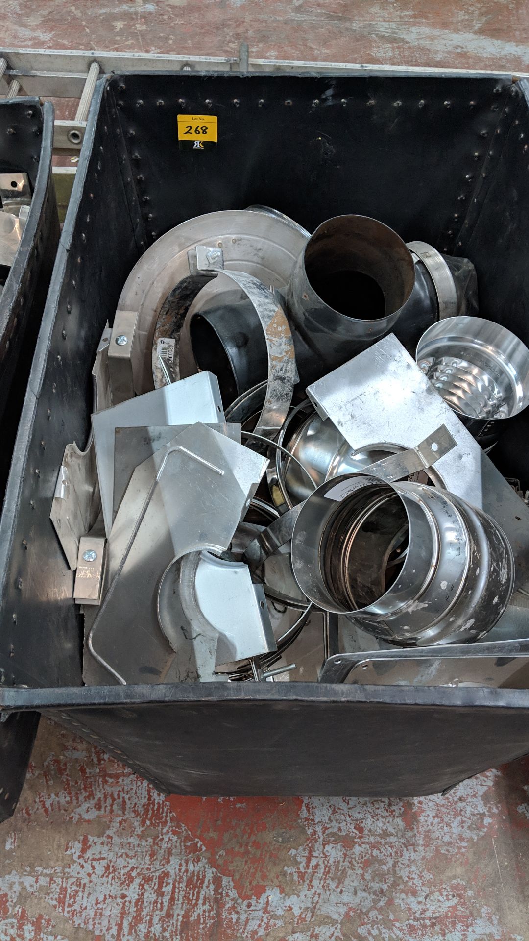 Contents of a wheelie bin of assorted primarily metal chimney/flue components - bin excluded