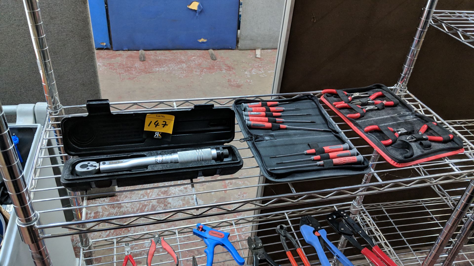 Contents of a shelf of tools comprising torque wrench plus clipper set & screwdriver set