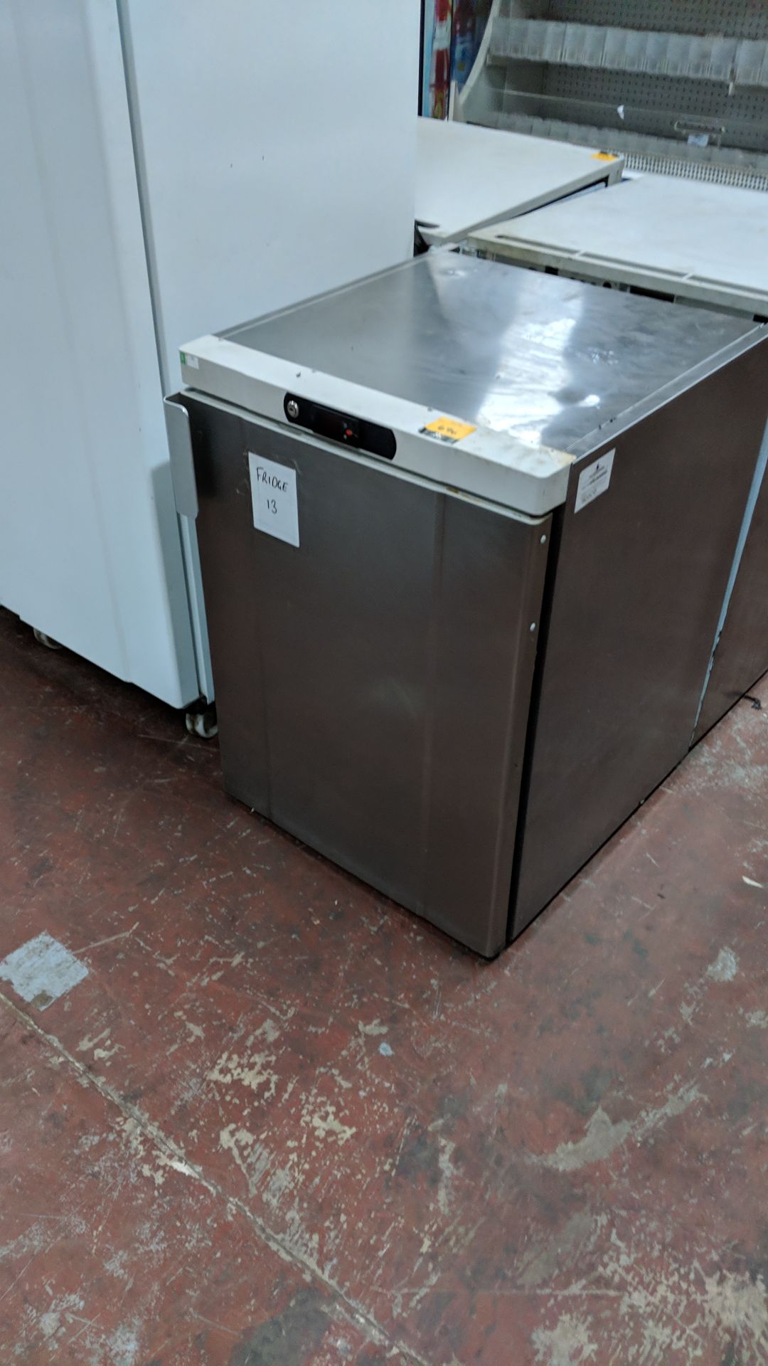 Stainless steel under counter fridge IMPORTANT: Please remember goods successfully bid upon must