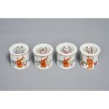 Four cylindrical Chinese famille rose covered boxes, 19th C.