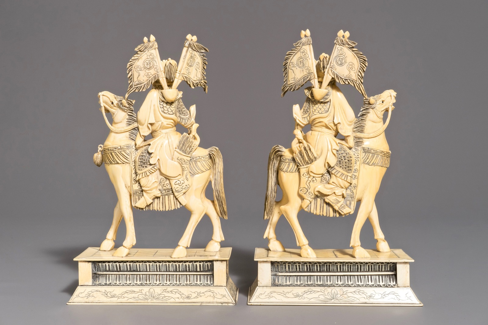 A pair of Chinese carved ivory horseriders, 19th C. - Image 4 of 9