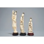 Three Chinese carved ivory figures of ladies on wooden stands, 2nd half 19th C.