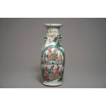 A Chinese famille rose vase with circular court scene design, 19th C.