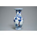 A Chinese blue, white and iron red vase with deer, 19/20th C.