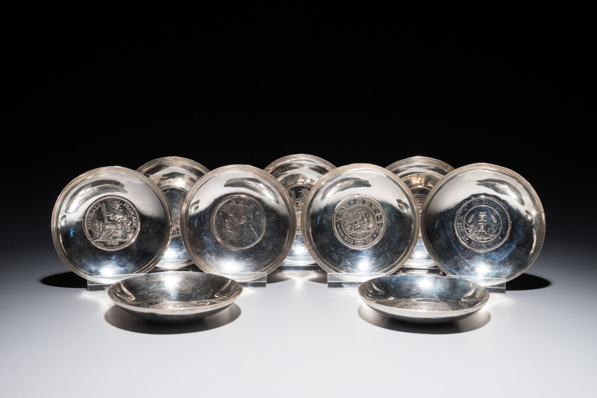 Nine Chinese silver coin bowls, mark of Wang Hing, 19/20th C.