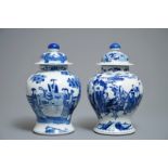 Two Chinese blue and white vases and covers with figures, 19th C.