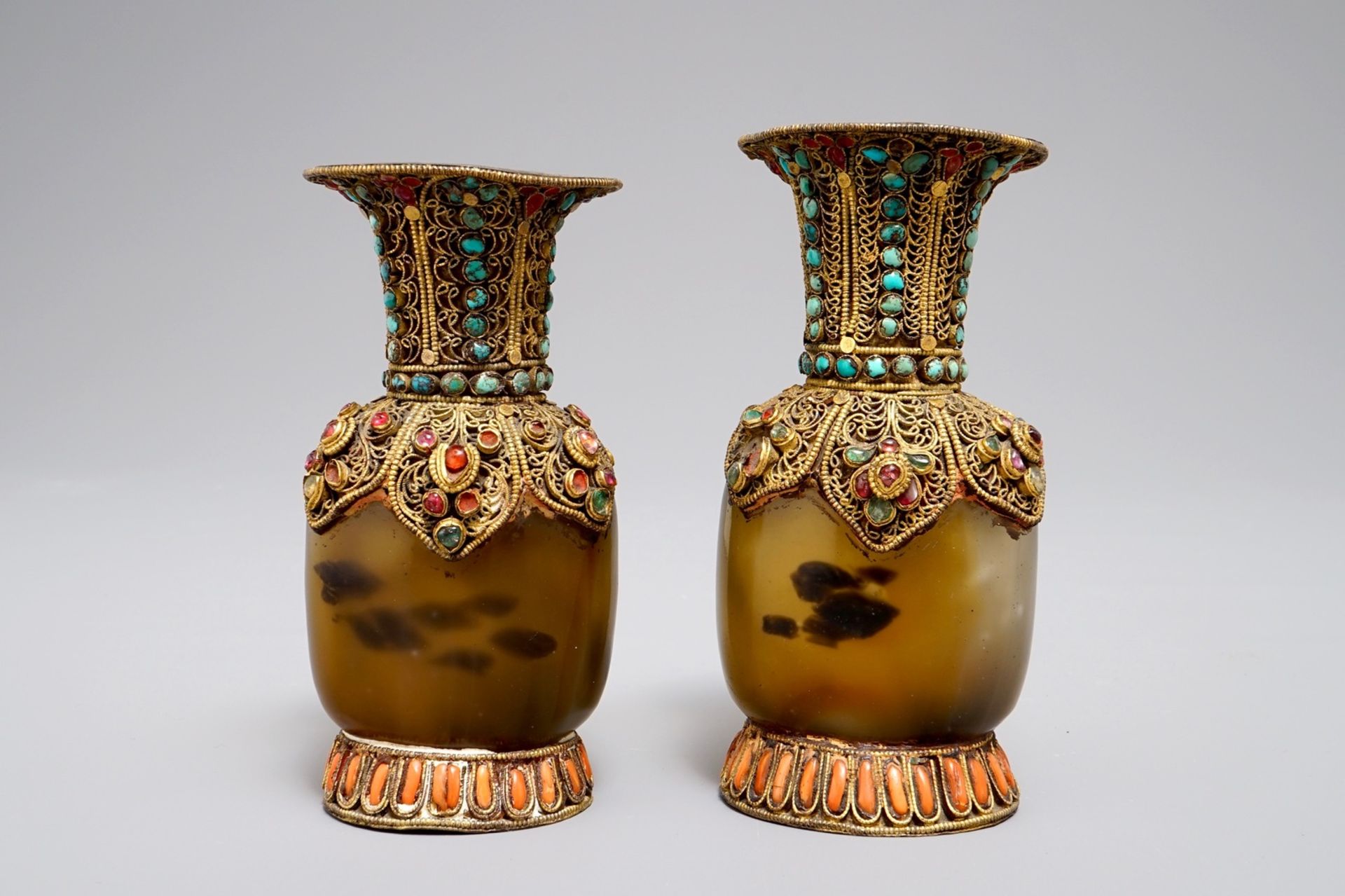 A pair of Tibetan agate flasks with turquoise- and coral-inlaid gilt silver mounts, 19th C. - Image 3 of 6