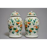 A pair of Chinese famille rose covered vases with boys among pumpkin vines, 19th C.