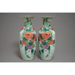 A pair of Chinese famille rose vases with floral design, 19/20th C.