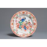 A Chinese famille rose plate with figures around a carriage, Yongzheng