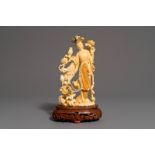 A Chinese carved ivory figure of Chang'e on wooden base, 1st half 20th C.