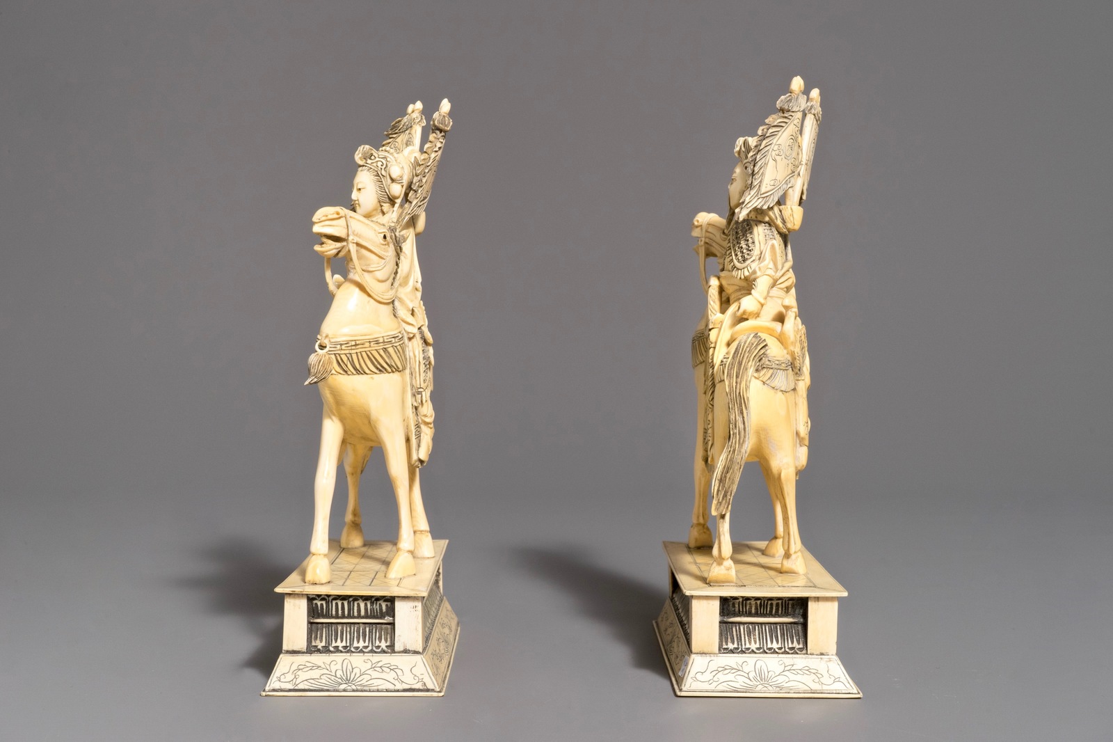A pair of Chinese carved ivory horseriders, 19th C. - Image 3 of 9