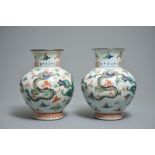 A pair of Chinese wucai dragon vases, Wanli mark, 19th C.