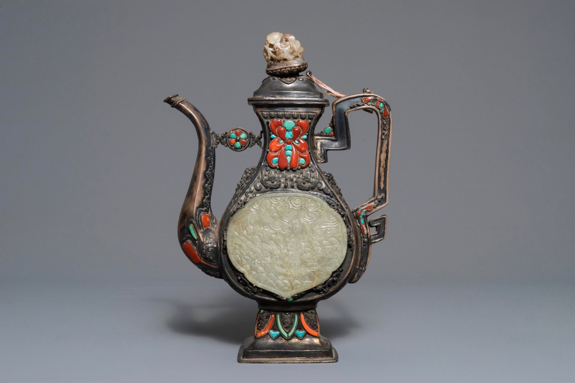 A silver-plated coral, jade and turquoise inlaid ewer and cover, Tibet or Mongolia, 19/20th C. - Image 2 of 9