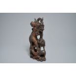 An Indonesian calamandar wooden sculpture of Vishnu riding Naga, 19th C.