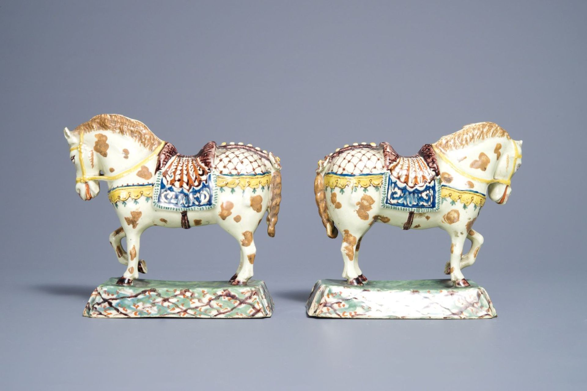 A pair of polychrome Dutch Delft lime-green ground models of circus horses, 19th C. - Image 4 of 7