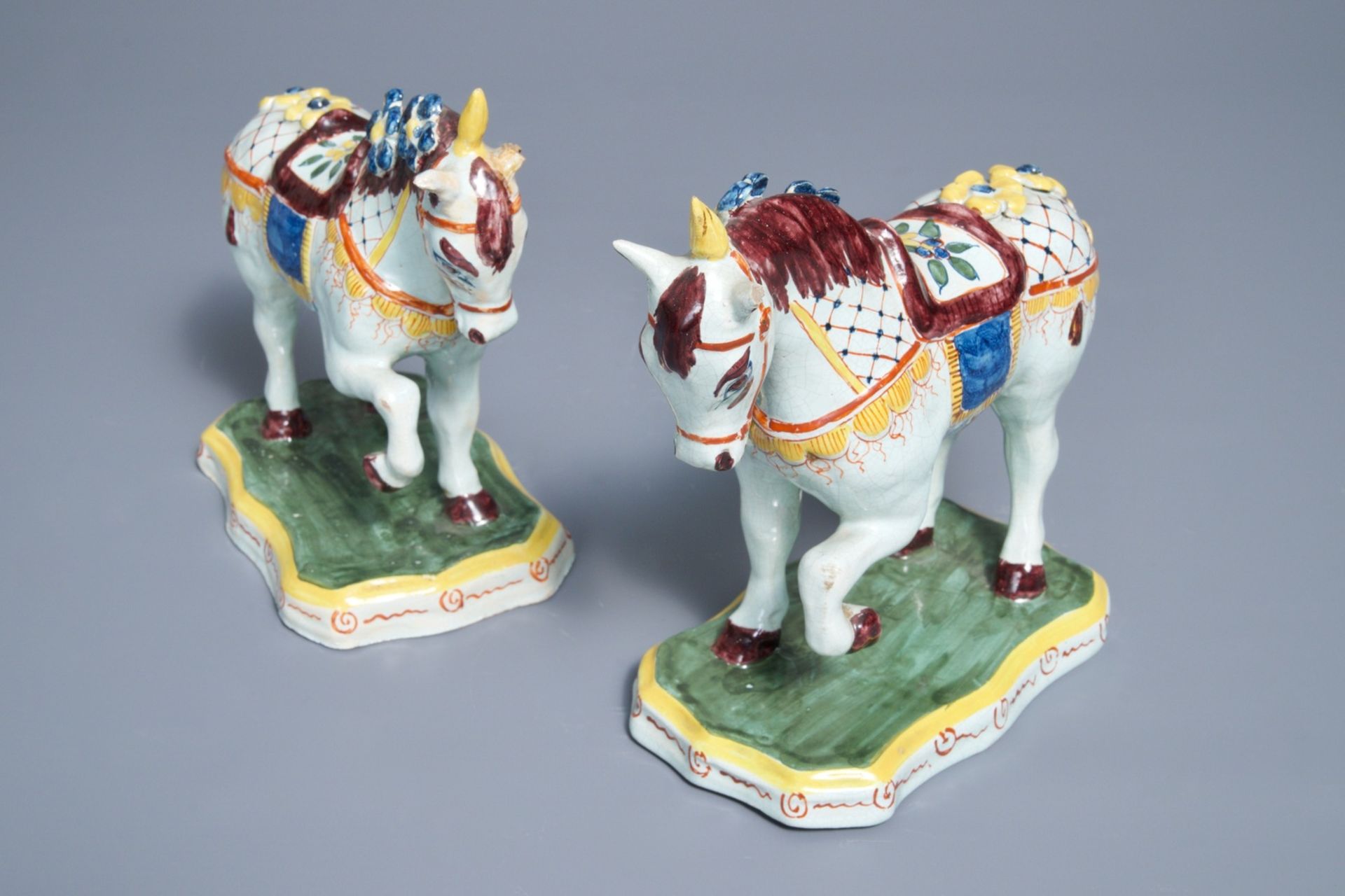 A pair of polychrome Dutch Delft models of circus horses, 19th C.