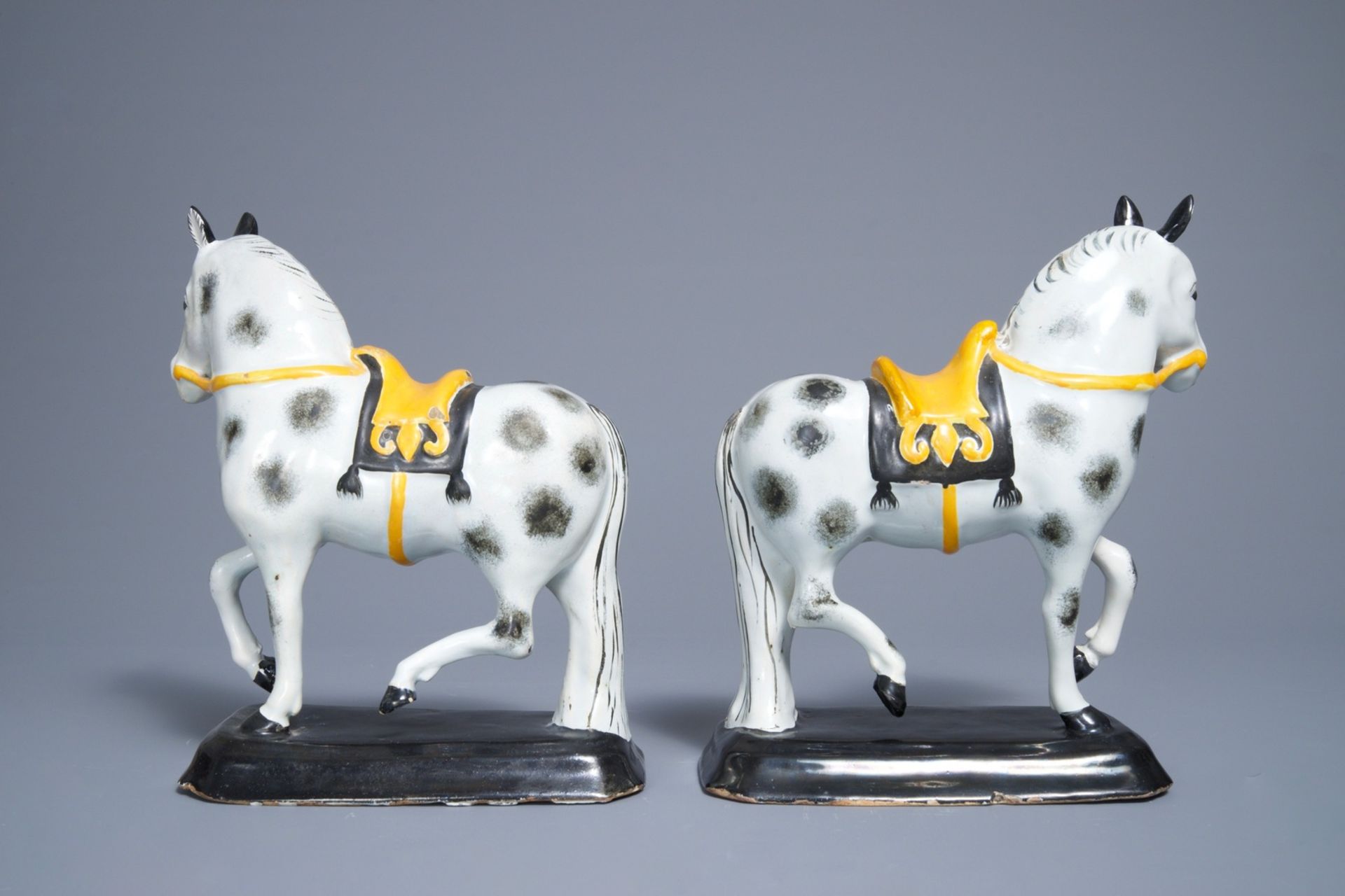 A pair of polychrome Dutch Delft black and yellow models of circus horses, 19th C. - Image 4 of 7