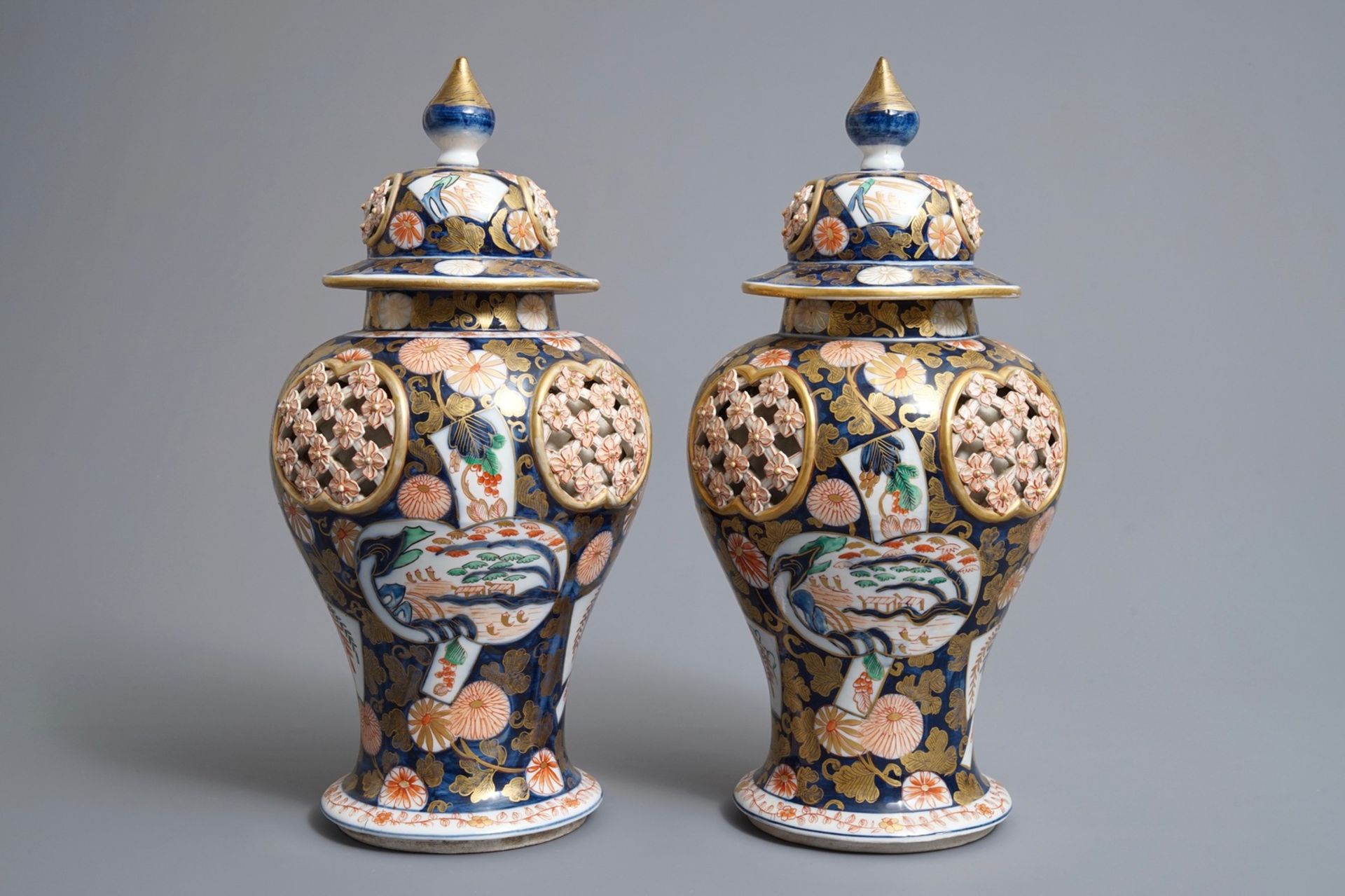 A pair of Imari-style double-walled reticulated vases and covers, Samson, Paris, 19th C.