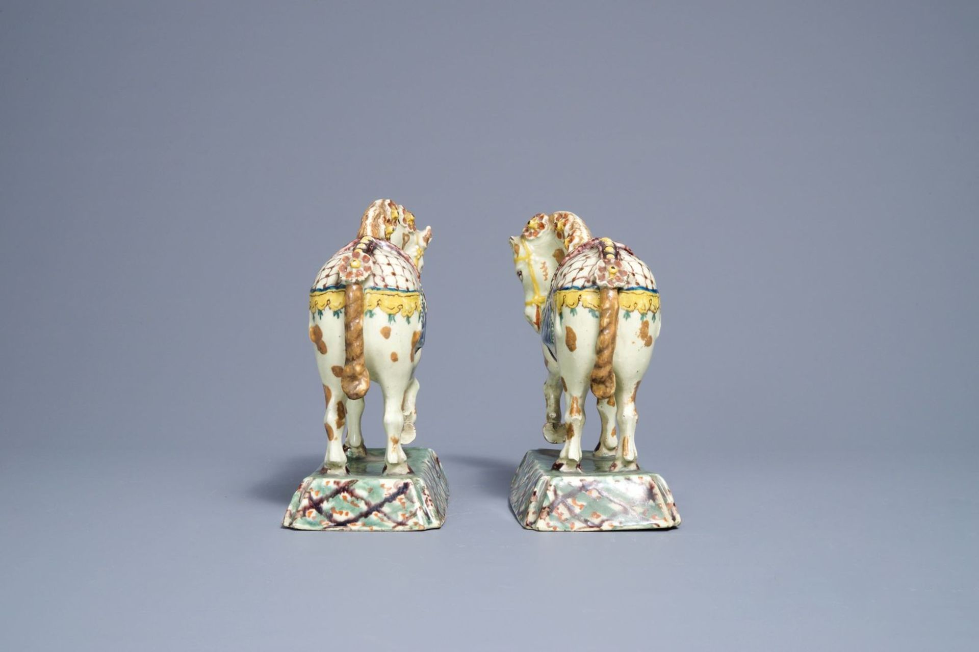 A pair of polychrome Dutch Delft lime-green ground models of circus horses, 19th C. - Image 5 of 7