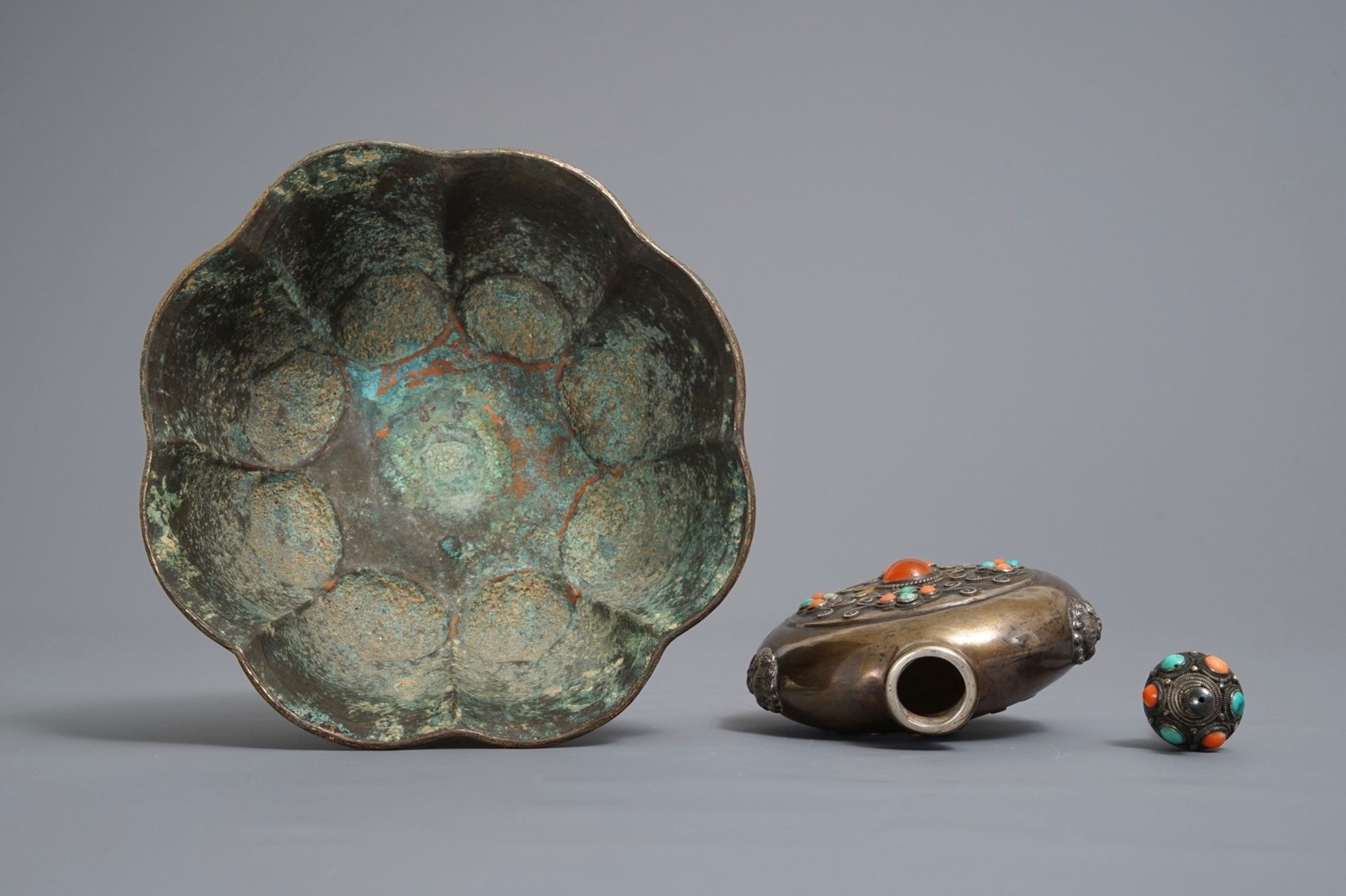 A gilt brass bowl and an inlaid silver flask, Tibet, 19/20th C. - Image 7 of 8