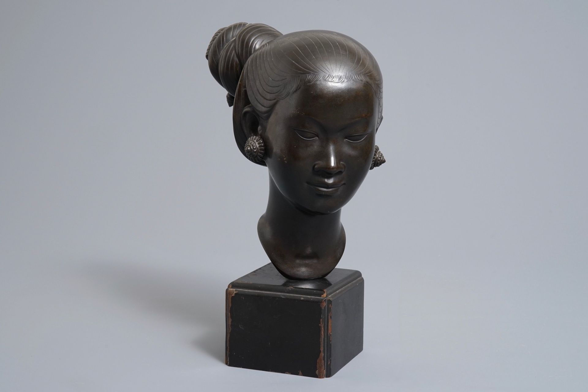 Nguyen Thanh Le (Vietnam, 1919-2006), A bronze head of a young woman on wooden base