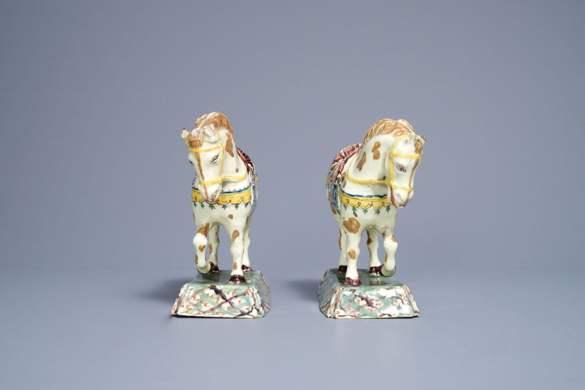 A pair of polychrome Dutch Delft lime-green ground models of circus horses, 19th C. - Image 3 of 7