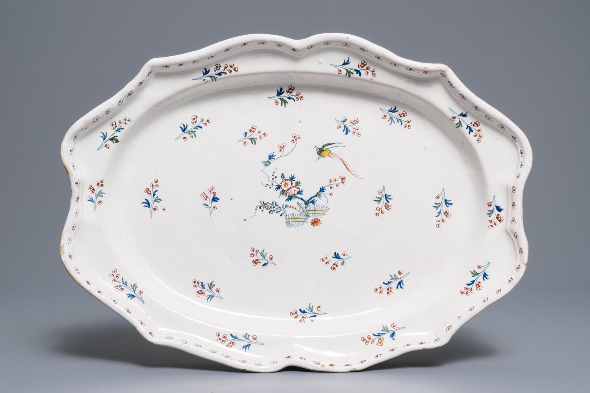 A large oval Brussels faience 'ˆ la haie fleurie' dish, 18th C.