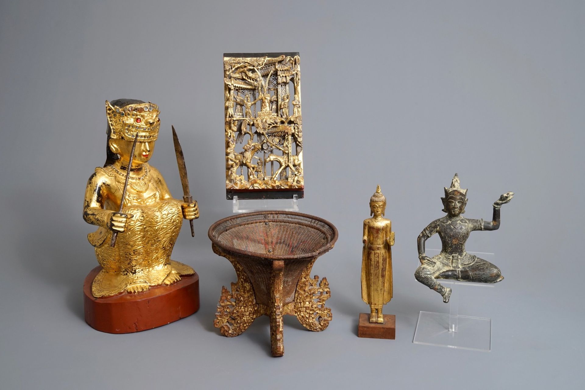 A collection of gilt wood carvings, a basket and a bronze figure, China & Southeast Asia, 19/20th C.