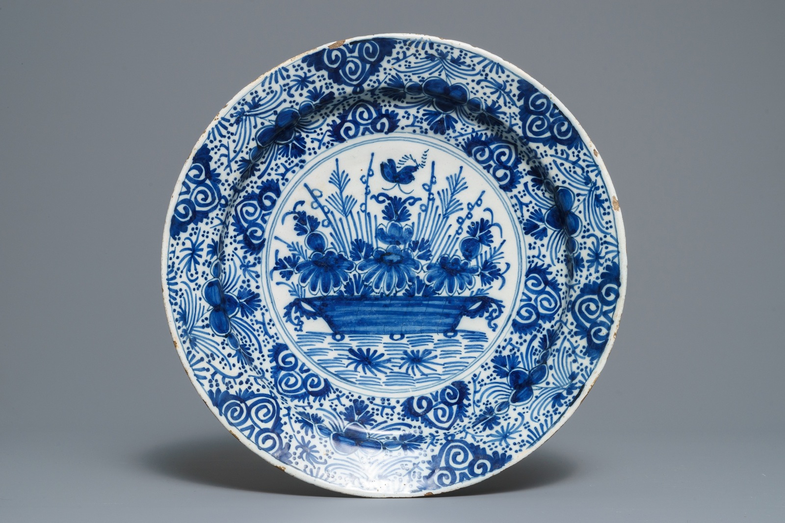 Two Dutch Delft blue and white chargers, an oval dish and a vase, 18th C. - Image 6 of 13